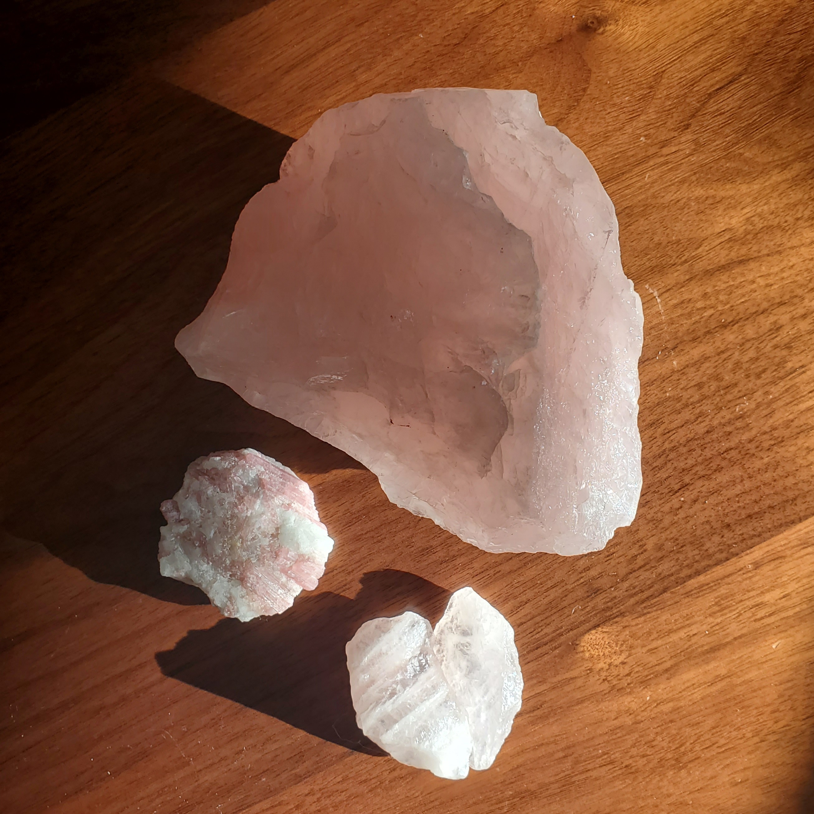 Rose quartz and pink tourmaline in raw form shining in the morning sun. Rose quartz and pink tourmaline in raw form shining in the morning sun.