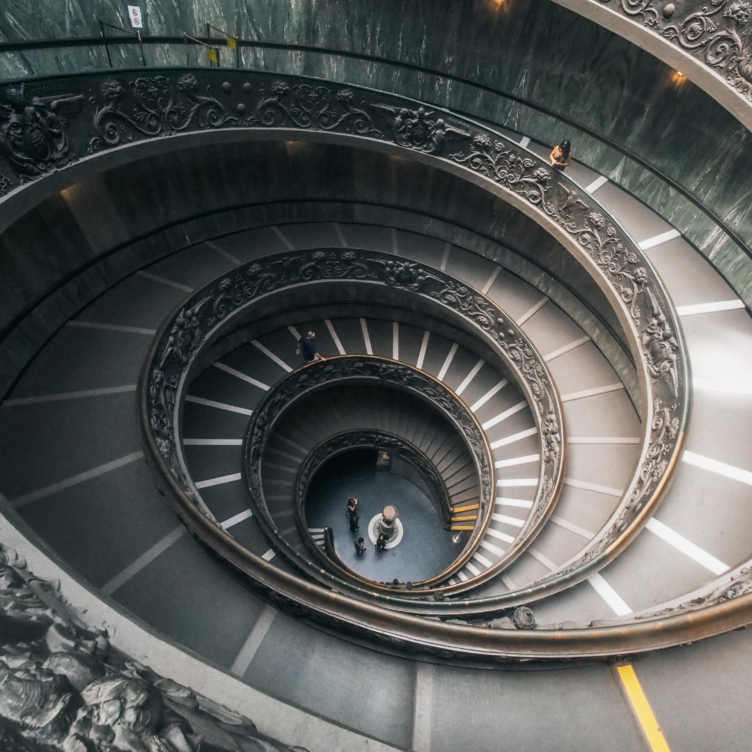 A photograph of a circular staircase that expands wider and wider. A photograph of a circular staircase that expands wider and wider.