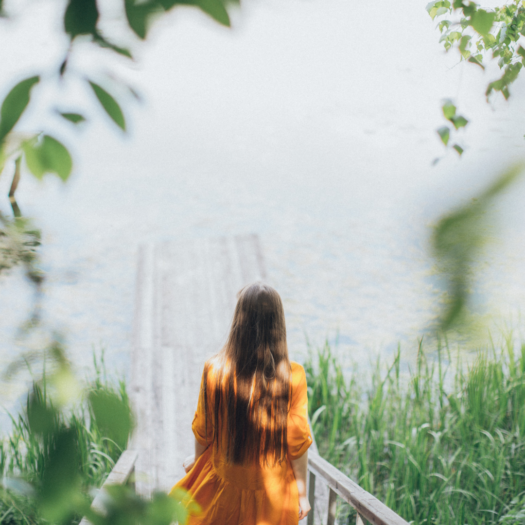 A person looking out over the water.
