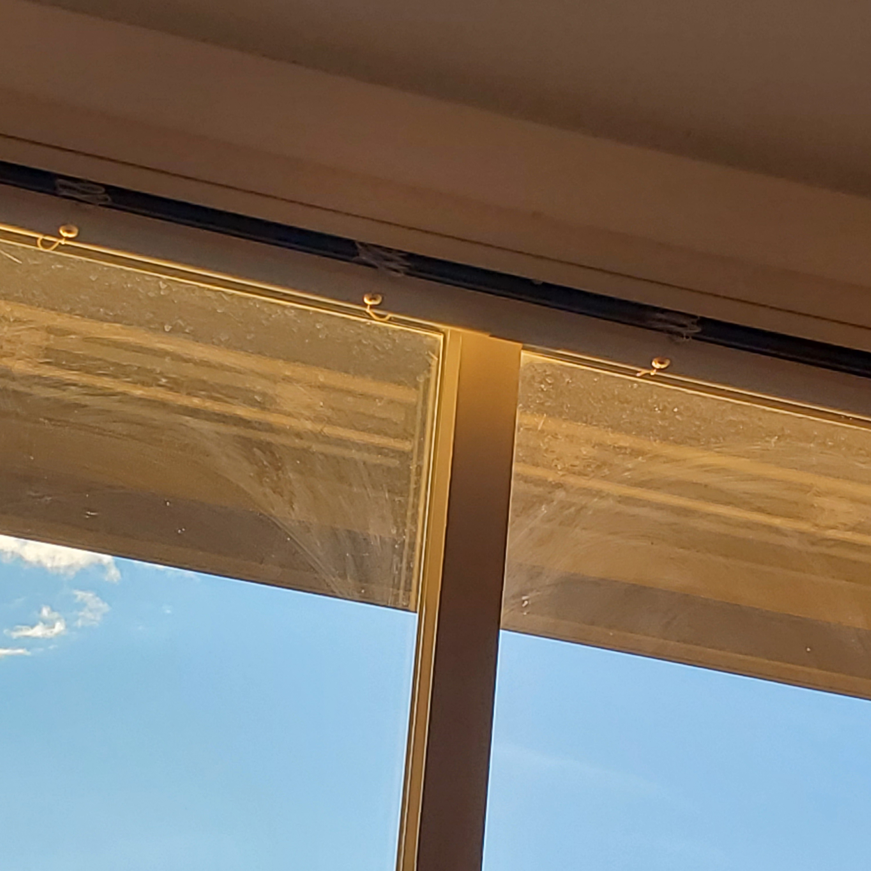 A sharply angled picture of the tops of my dirty windows.