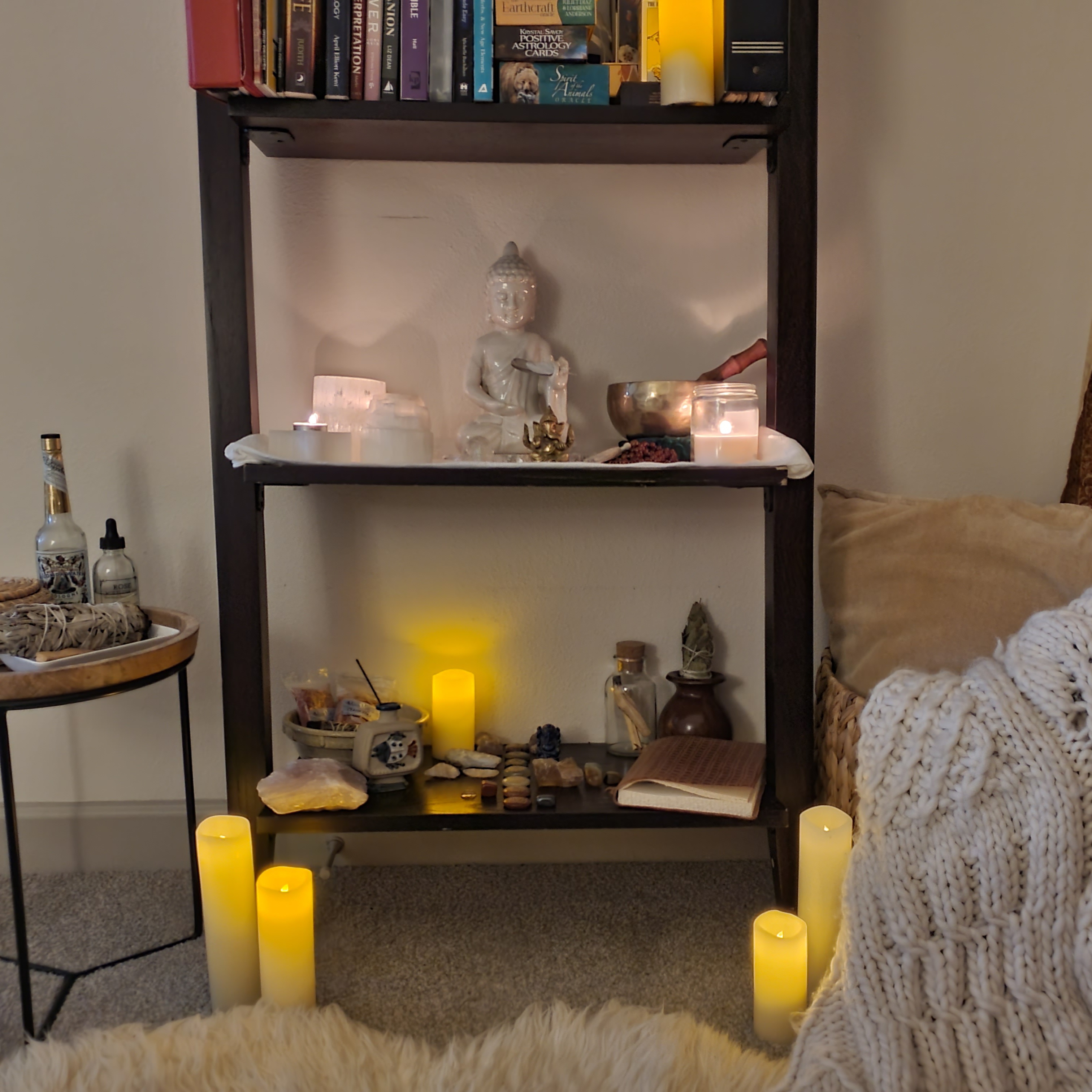 An image of my altar with white candle lit and glowing.