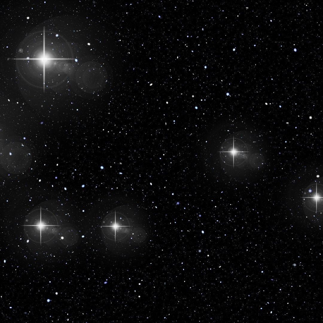 An image of dark space dotted with glowing stars.